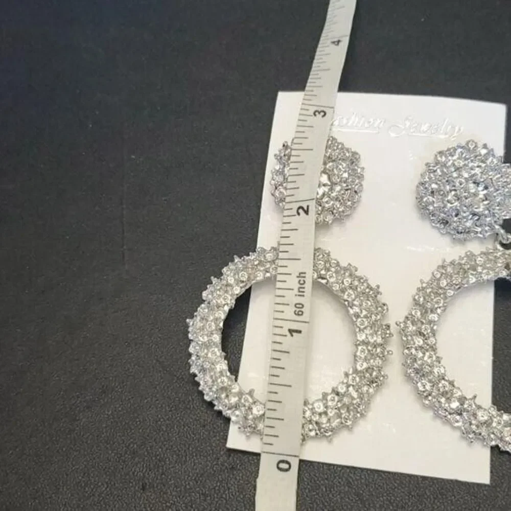 Silver tone circular themed statement earrings texture chunky